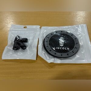 New sealed valve cap covers (4) & drink coasters (2) for Lincoln.